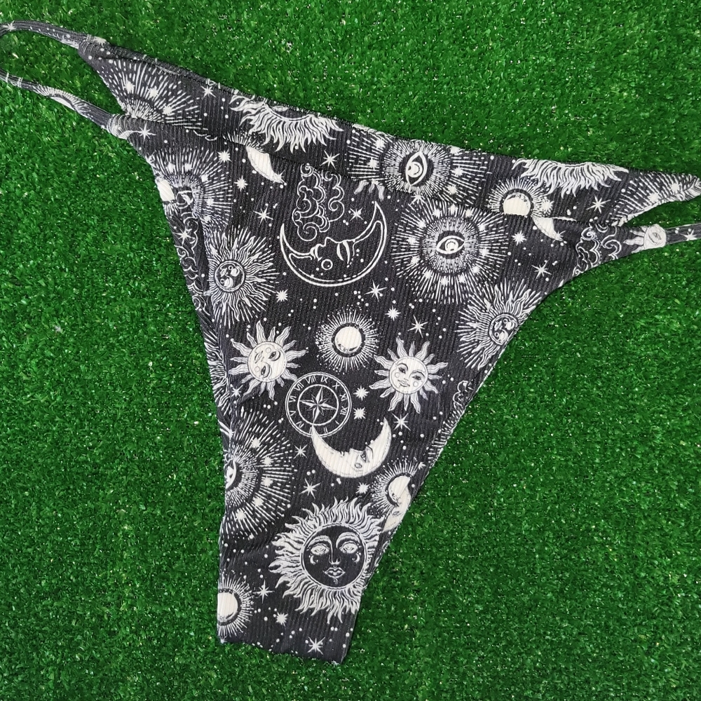 black swimsuit with constellation design.  I never used it.  It is Medium size.